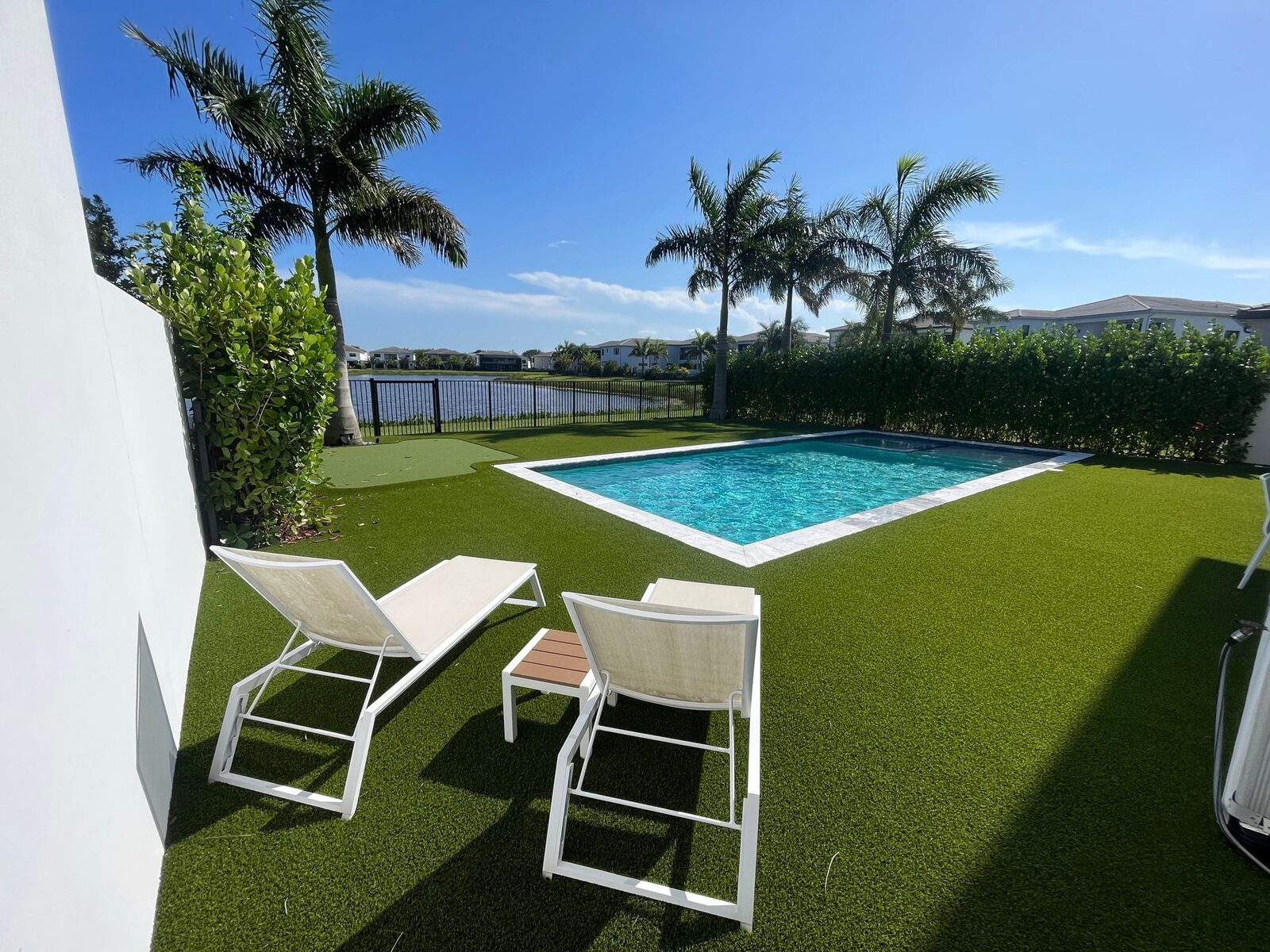 Waterfront pool and lounge deck by Forben Construction