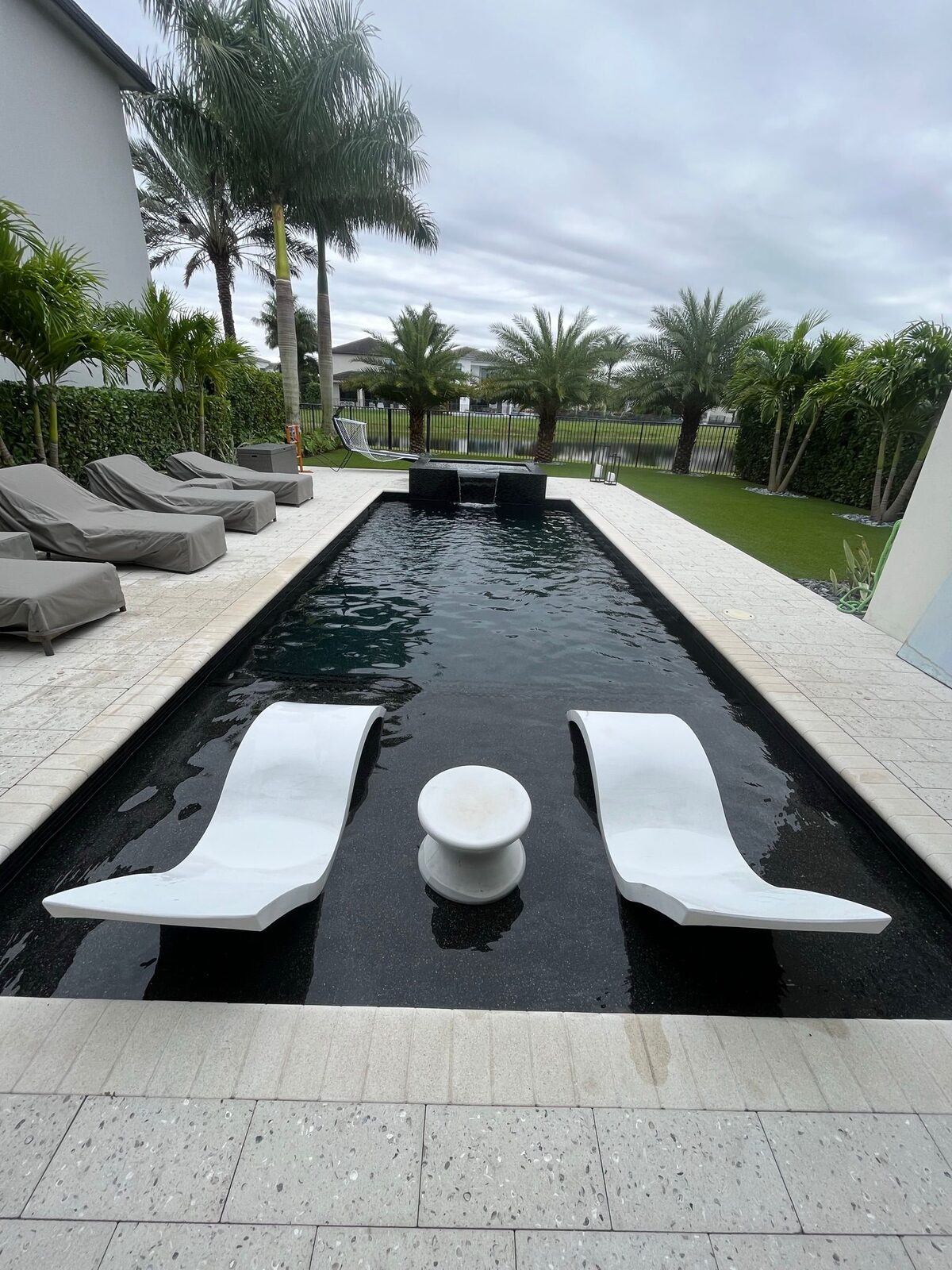 Lap pool with modern deck by Forben Construction