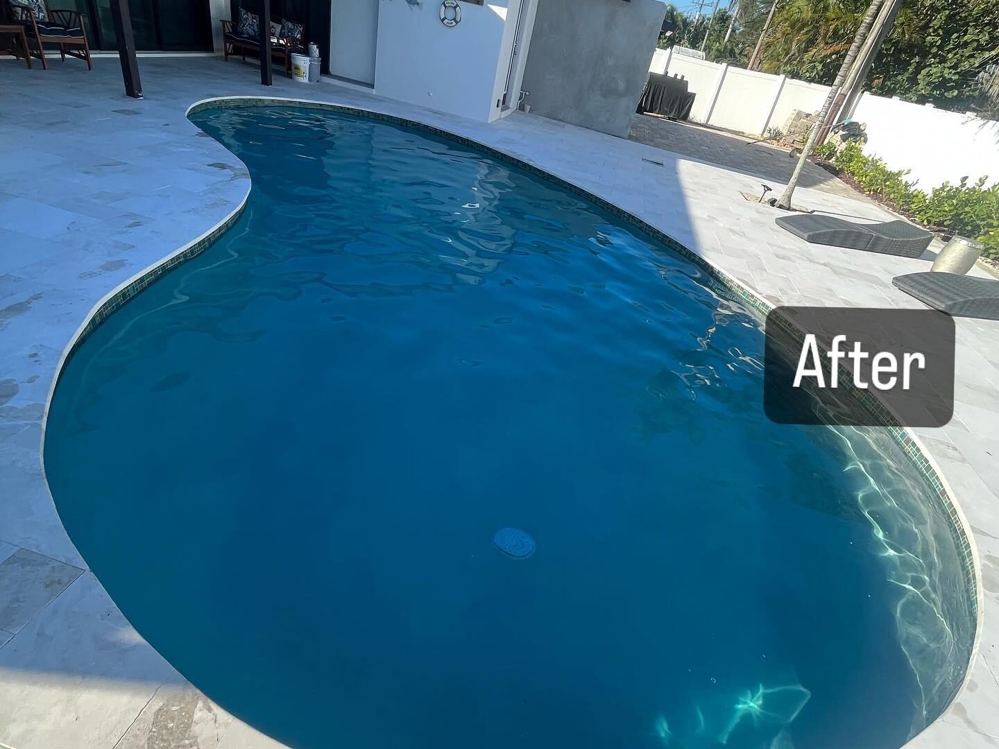 Home exterior with terrace and pool by Forben Construction